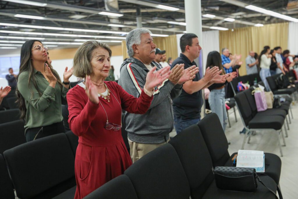 Congregation are serviring praising the lord at Iglesia Encuentro Ministry. 